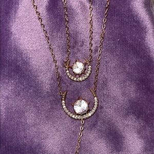 Set of two rose gold necklaces.